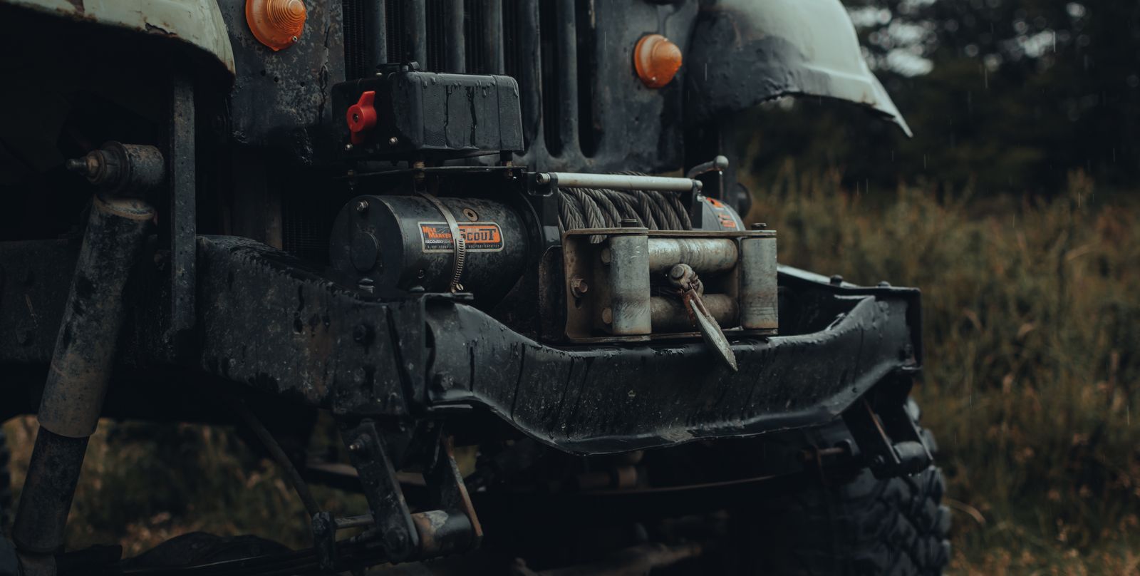 A close-up of a vehicle recovery winch and cable